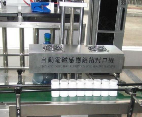 aluminum foil sealing machine การเหนี่ยวนำฟอยล์.jpg