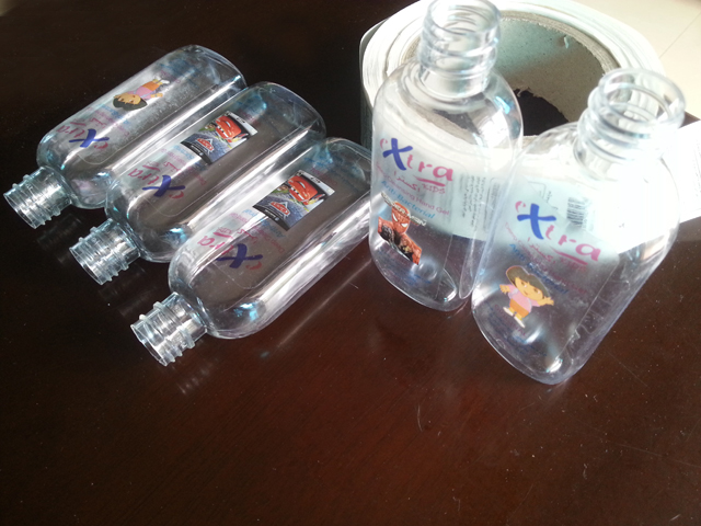transparent labels labelled samples bottles plane surface ตัวอย่างฉลากและขวดใสของ Mrwan (3).jpg